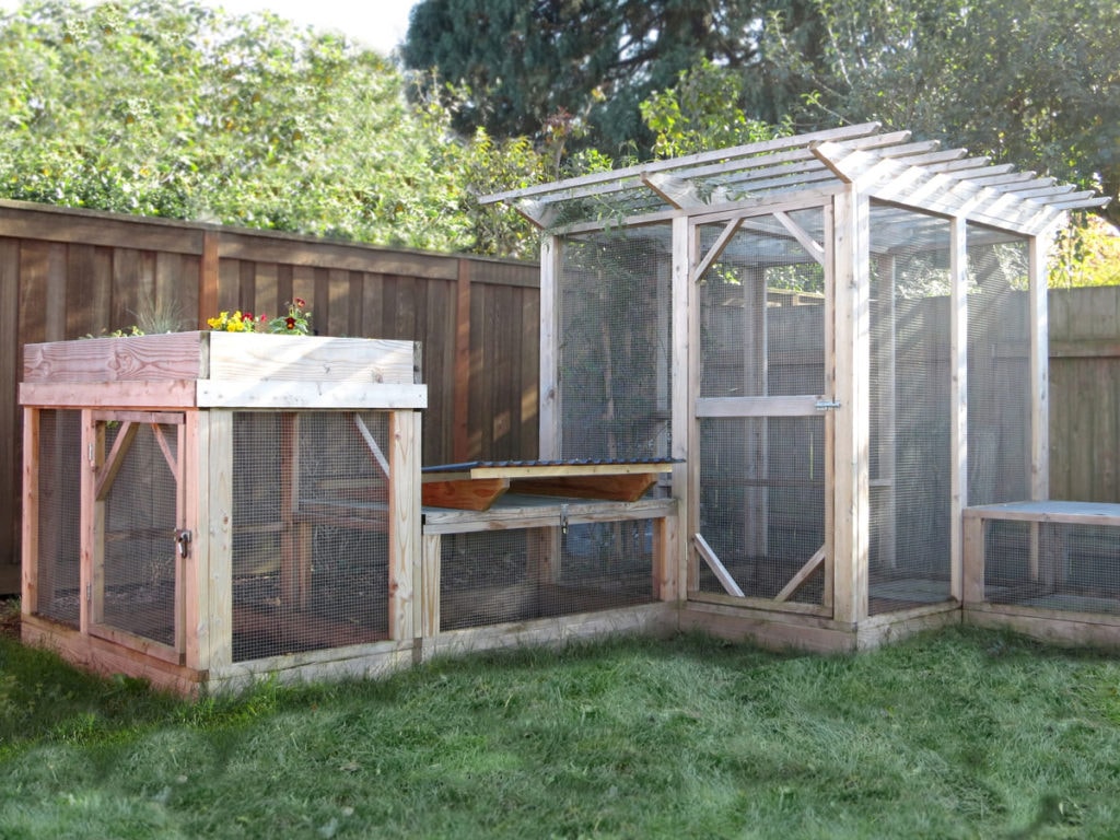 Series of three secure enclosed backyard chicken runs built from The Garden Run plans